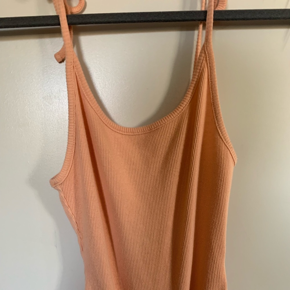 Peach body suit